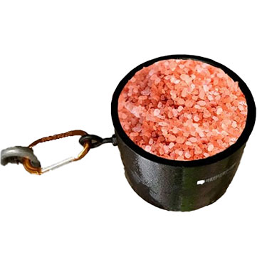 Premium Himalayan Animal Lick Salt granules in a mineral feed bucket for cattle, horses, sheep, goats, and other livestock.